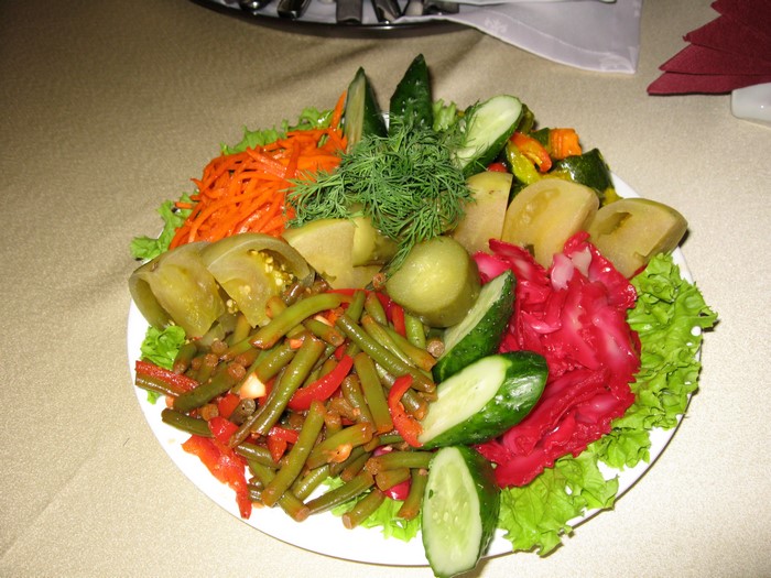 Plate of assorted pickled vegetables and salad