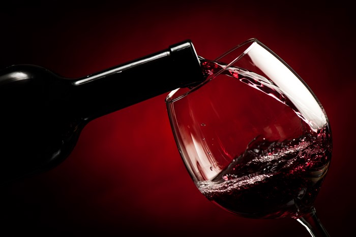 Red wine being poured into a glass