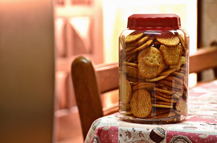 Jar of round crackers on a table