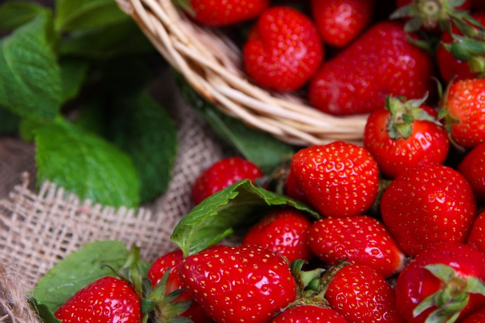 Strawberries in a basket with mint