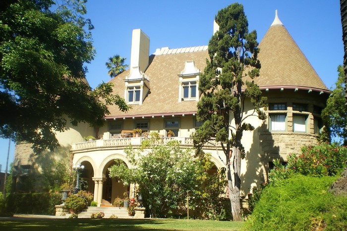 Mansion with conical tower and arched porch in Malibu, California