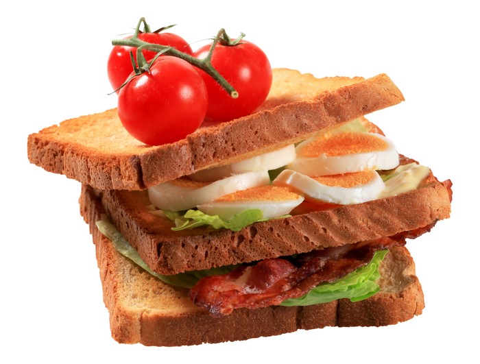 Sandwich with bacon, egg, lettuce, and tomatoes