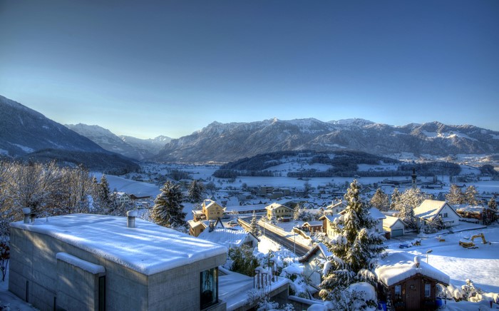 Houses and mountains in Kaltbrunn, Switzerland during winter