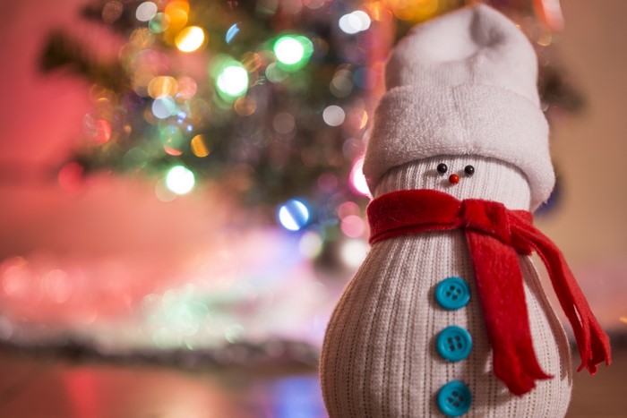Sock snowman with red scarf and Christmas tree lights