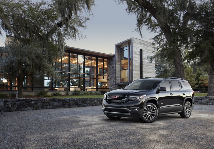 2016 GMC Acadia All Terrain in front of modern house