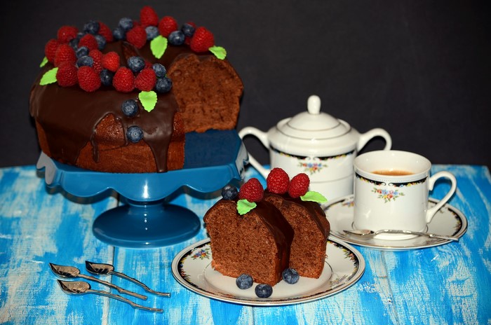 Chocolate cake with berries and coffee set