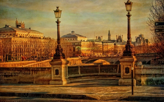 Parisian street lamps and buildings along the Seine River