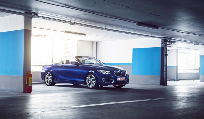 Blue BMW 220D Cabriolet in a parking garage