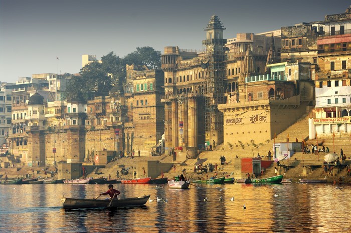 Ghats of Varanasi, India with boats on the Ganges River