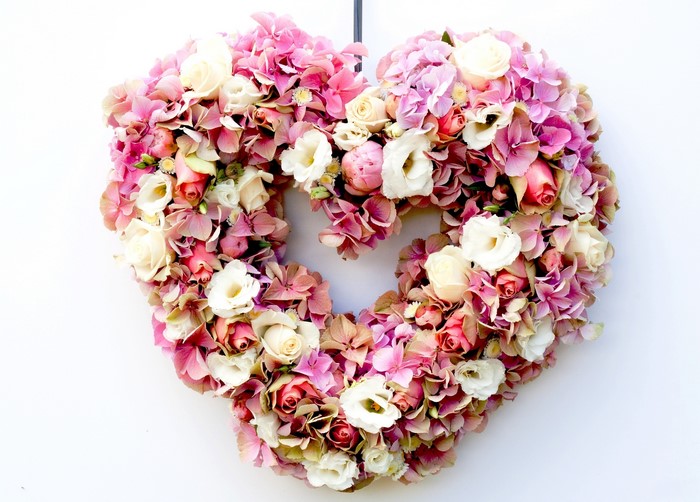 Heart-shaped floral arrangement with roses and hydrangeas
