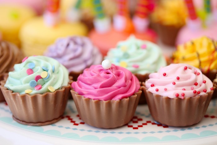 Assortment of colorful cupcakes with sprinkles