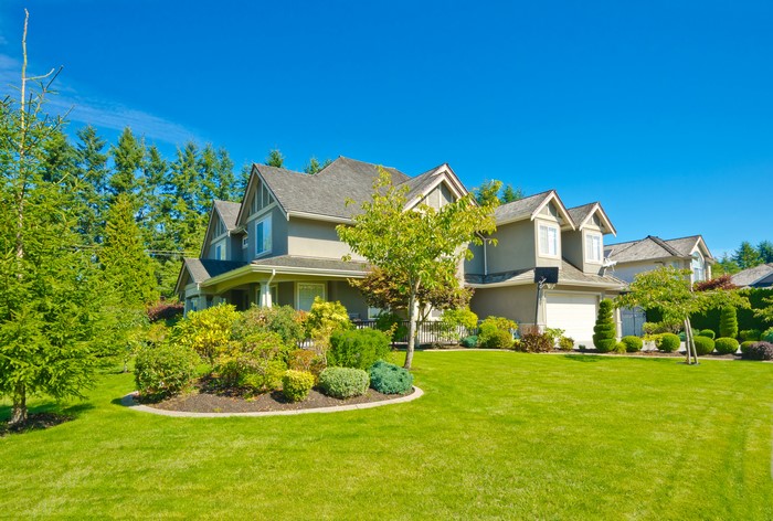 Houses with manicured lawns and trees