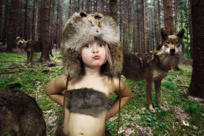 4K Image of Little Girl in Wolf Fur Hat in Forest