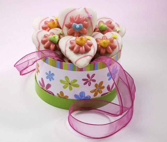 Heart-shaped cookies in a decorative box with ribbon