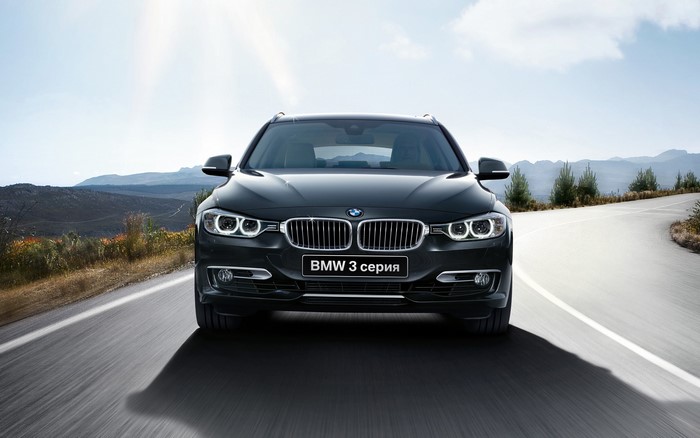 BMW 3 Series Touring car on a road