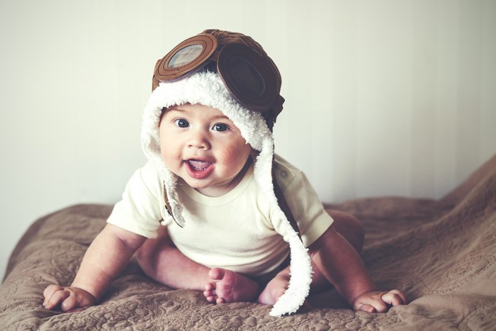 Baby wearing a pilot hat