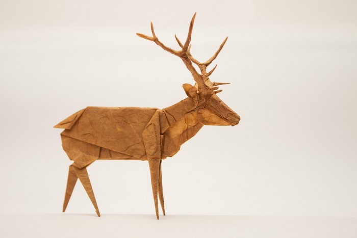 Intricate Origami Deer Sculpture on White Background