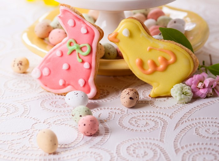 Easter cookies shaped like a rabbit and a chick with candy eggs