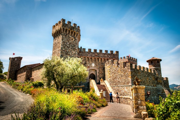 Castello di Amorosa castle with gardens and blue sky