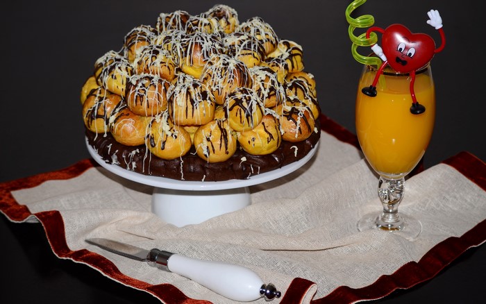 Profiterole Cake and Orange Juice with Heart Garnish