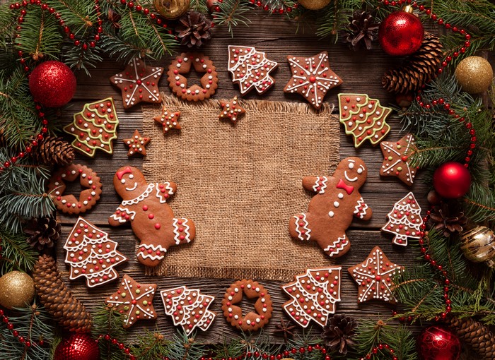 Christmas cookies and decorations on wooden table