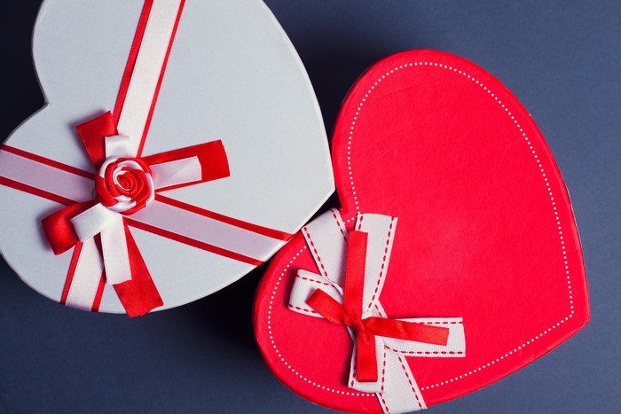 Two heart-shaped gift boxes with bows