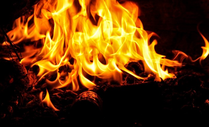 Close-up of a bright orange and yellow fire