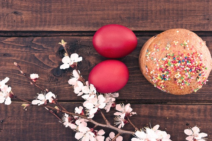Easter eggs and kulich with cherry blossoms