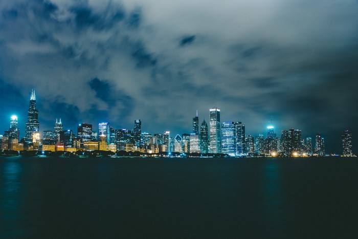 Chicago city skyline at night over water