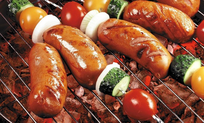 Sausages and vegetables on a grill