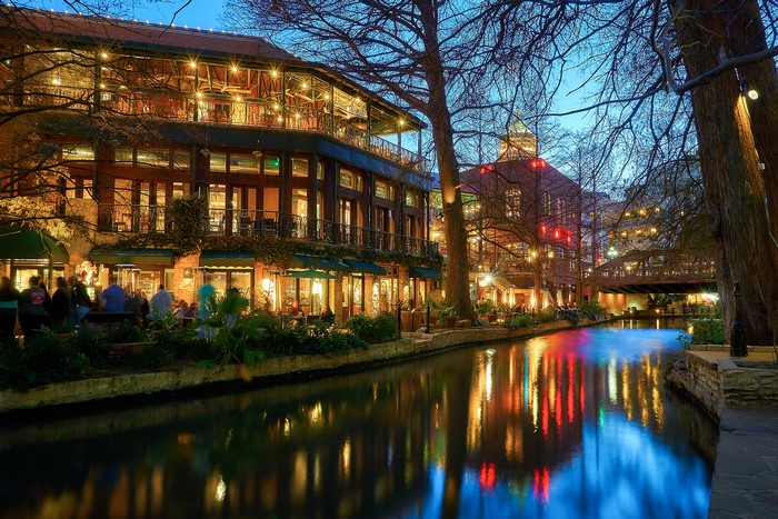 San Antonio Riverwalk at night with reflections