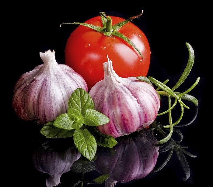 Tomato, Garlic, Mint, and Rosemary on Black Background