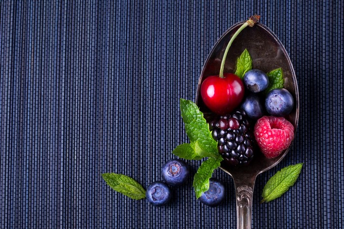 Berries and mint on a spoon
