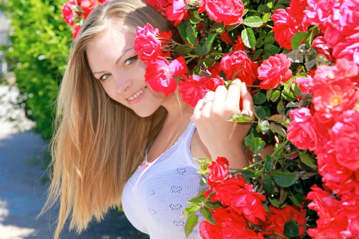 Alessandra A among red roses