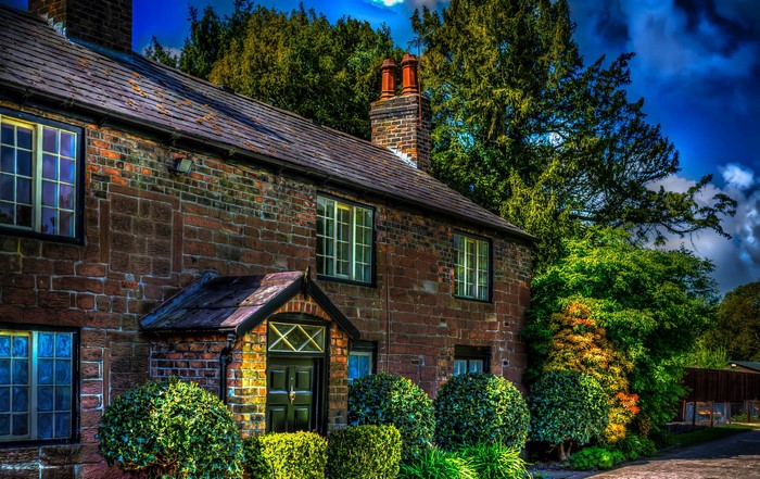 Brick House with Chimney and Trees in England