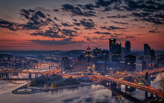 Pittsburgh skyline at dusk with bridges over the river