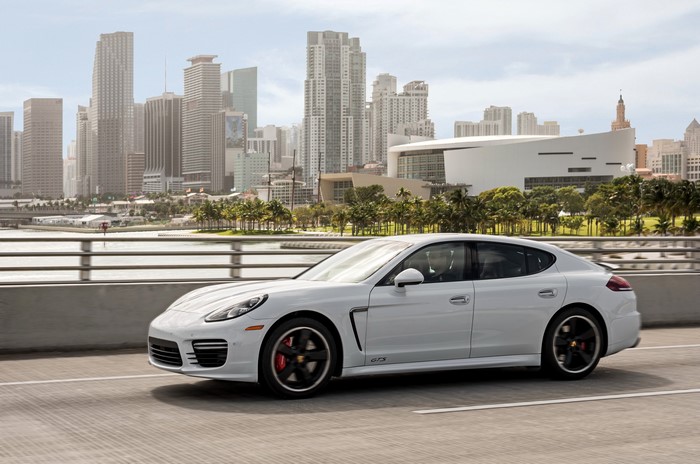 White 2014 Porsche Panamera GTS driving in Miami