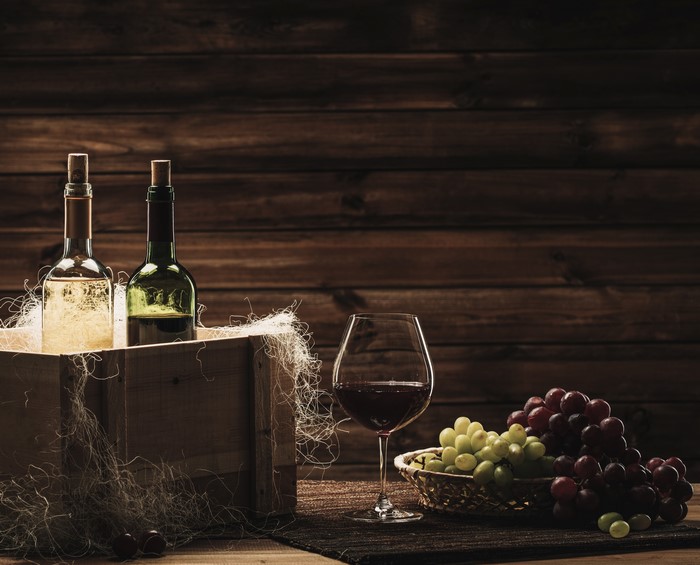Wine bottles, grapes, and wine glass