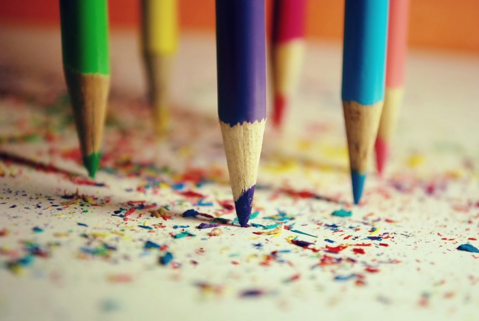 Close-up of sharpened colored pencils and shavings