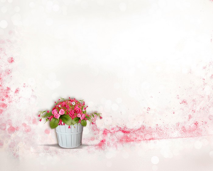 Pink roses in a white bucket with pink floral accents
