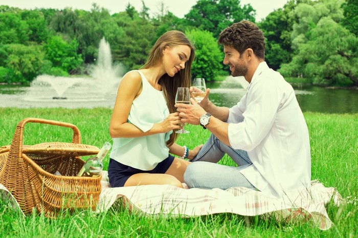 Couple having a picnic by a lake