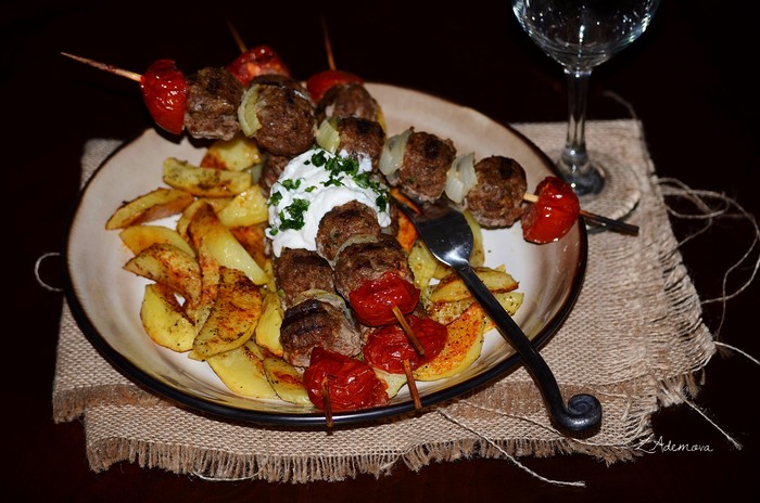 Shashlik with French fries and yogurt sauce