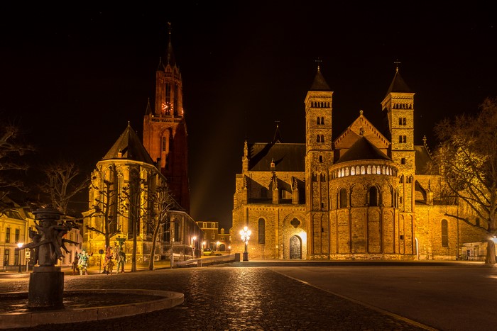 Churches and sculpture at night in Maastricht, Netherlands
