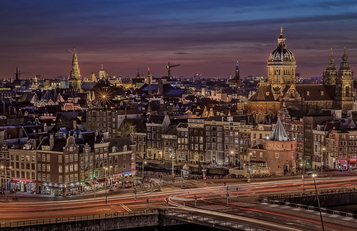 Amsterdam cityscape at night with light trails