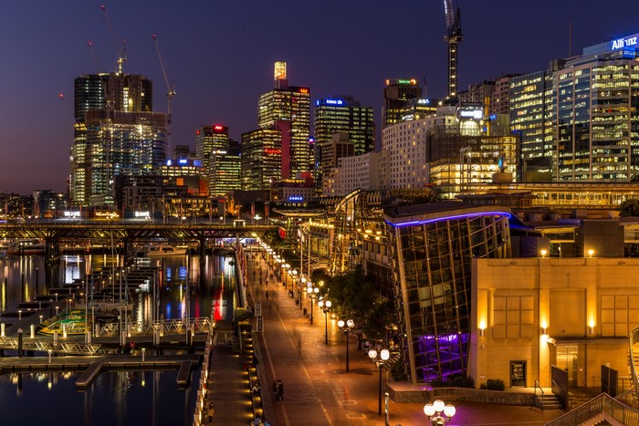 Sydney cityscape at night with marina and illuminated buildings