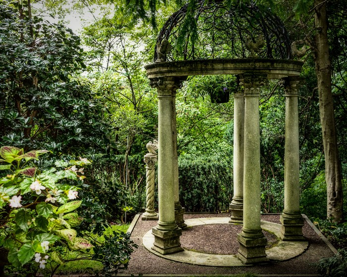 Gazebo with columns in a garden