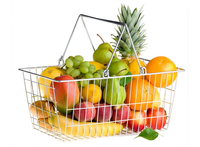 Fruit basket with apples, oranges, pears, grapes, pineapple, and mango