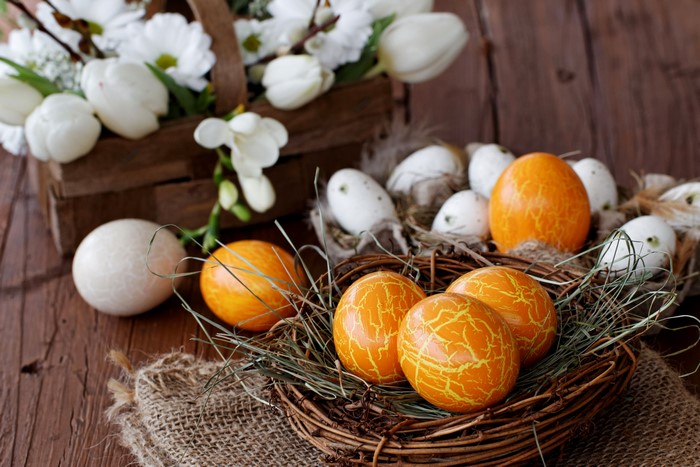 Easter eggs in nests with flowers