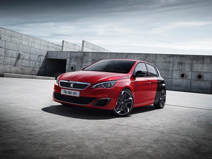 Red Peugeot 308 GTi parked in concrete area