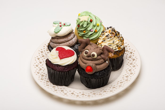 Assortment of decorated cupcakes on a plate